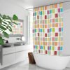 Vibrant multicolored shower curtain with a bold checkered design and sturdy metal grommets for hanging