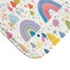 Detailed view of soft microfiber rainbow bath mat for kids' bathroom decor.
