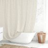 Coastal beige and white pebble striped shower curtain by Ozscape Designs hanging in a bathroom.