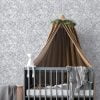 Gray watercolor leaf neutral wallpaper in a baby nursery