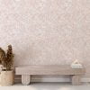 Elegant peach blush pink watercolor leaf peel and stick wallpaper in a serene hallway