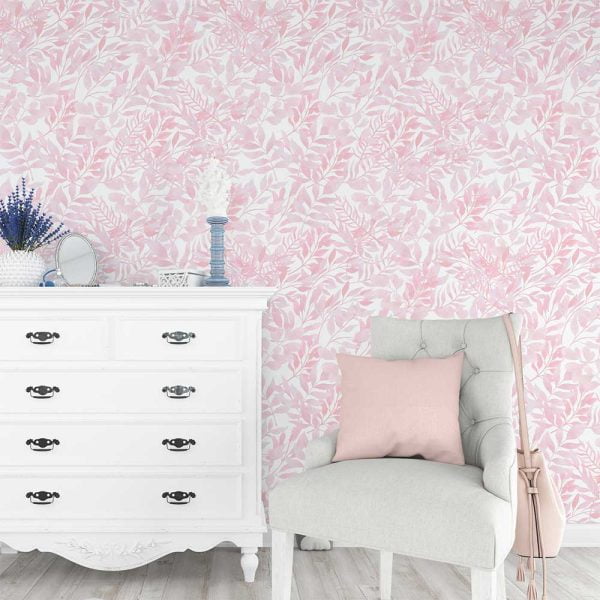 Soft pink watercolor leaves wallpaper in a baby nursery, creating a calming and cozy atmosphere