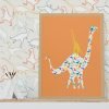 Dinosaur wallpaper in modern contemporary design with orange, gray, blue, mustard, and white colors in a kids bedroom.