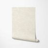 Close-up detail of beige and white elephant wallpaper sample