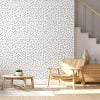 Black and white polka dot contemporary wallpaper in a living room
