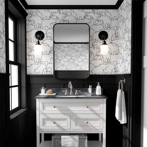 Fun black and white elephant wallpaper in a kids bathroom