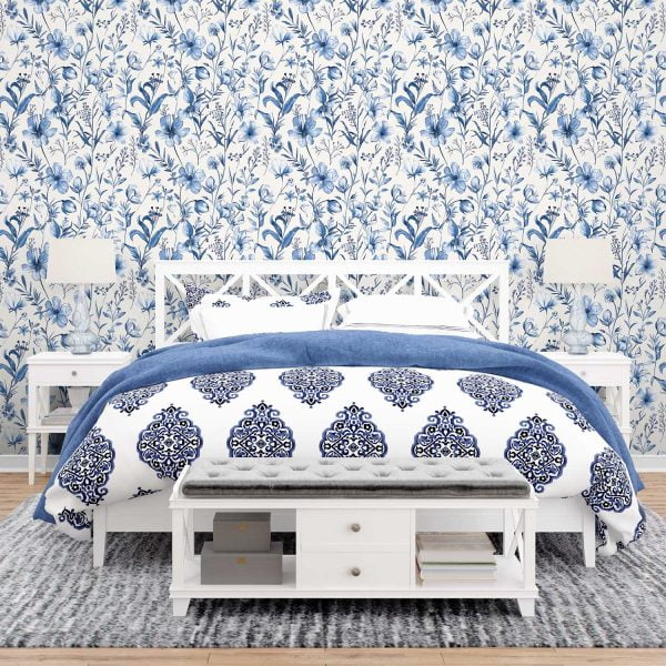 Elegant blue watercolor floral wallpaper in a serene bedroom