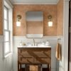 Boho burnt orange elephant wallpaper in a kids bathroom