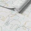 Close-up detail of grey, green and white elephant wallpaper sample