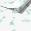 Detailed view of a mint green dinosaur wallpaper roll, available in vinyl, paper, or fabric peel and stick options