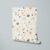 Neutral space-themed wallpaper with beige background, stars, moon, and planets in blue, gray, and brown.