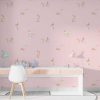 Pink puppy dog wallpaper in kids' playroom.