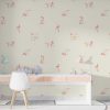 Pink puppy dog wallpaper for kids in beige kids' playroom.