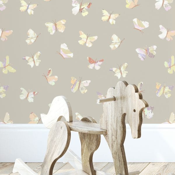Boho-style playroom with an accent wall featuring abstract butterfly beige wallpaper.