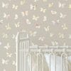 Cozy baby nursery with Boho Butterfly Beige Wallpaper, featuring soft neutral tones and abstract modern butterfly patterns.